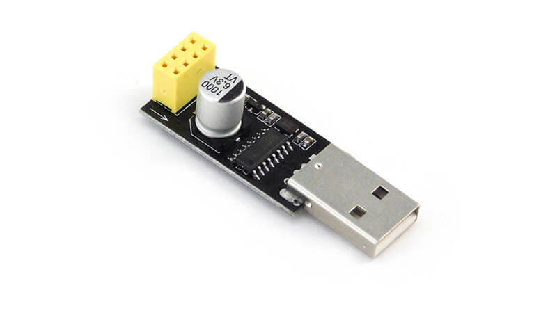 A picture of an ESP-01 programmer adapter used for programming the ESP-01 and control it thru the router