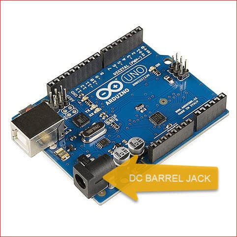 Picture of an Arduino Uno development board showing the DC barrel jack for connecting a power supply